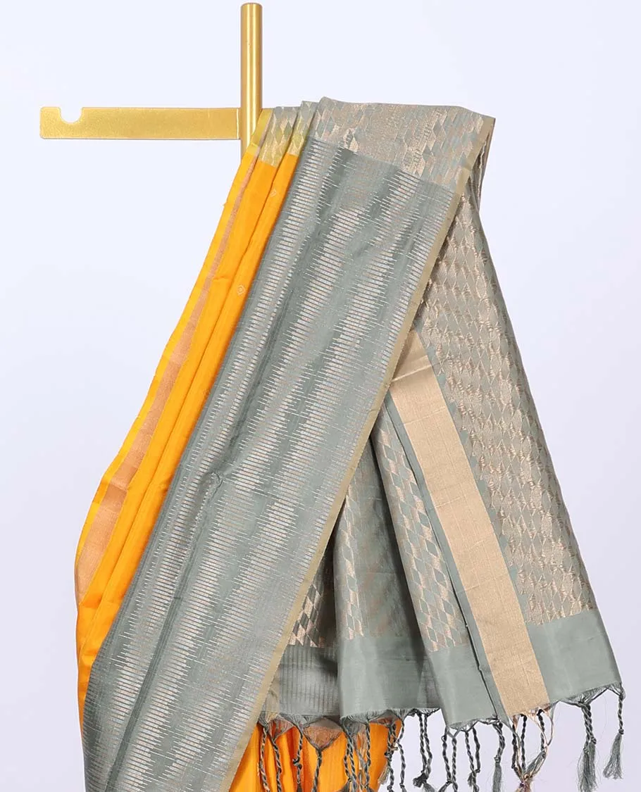 Orange soft silk saree with buttas, contrast unique design border & pallu of geometric zari designs