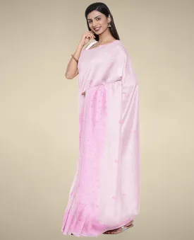 Pink kota cotton saree features unique buttas, self-border with intricate designs